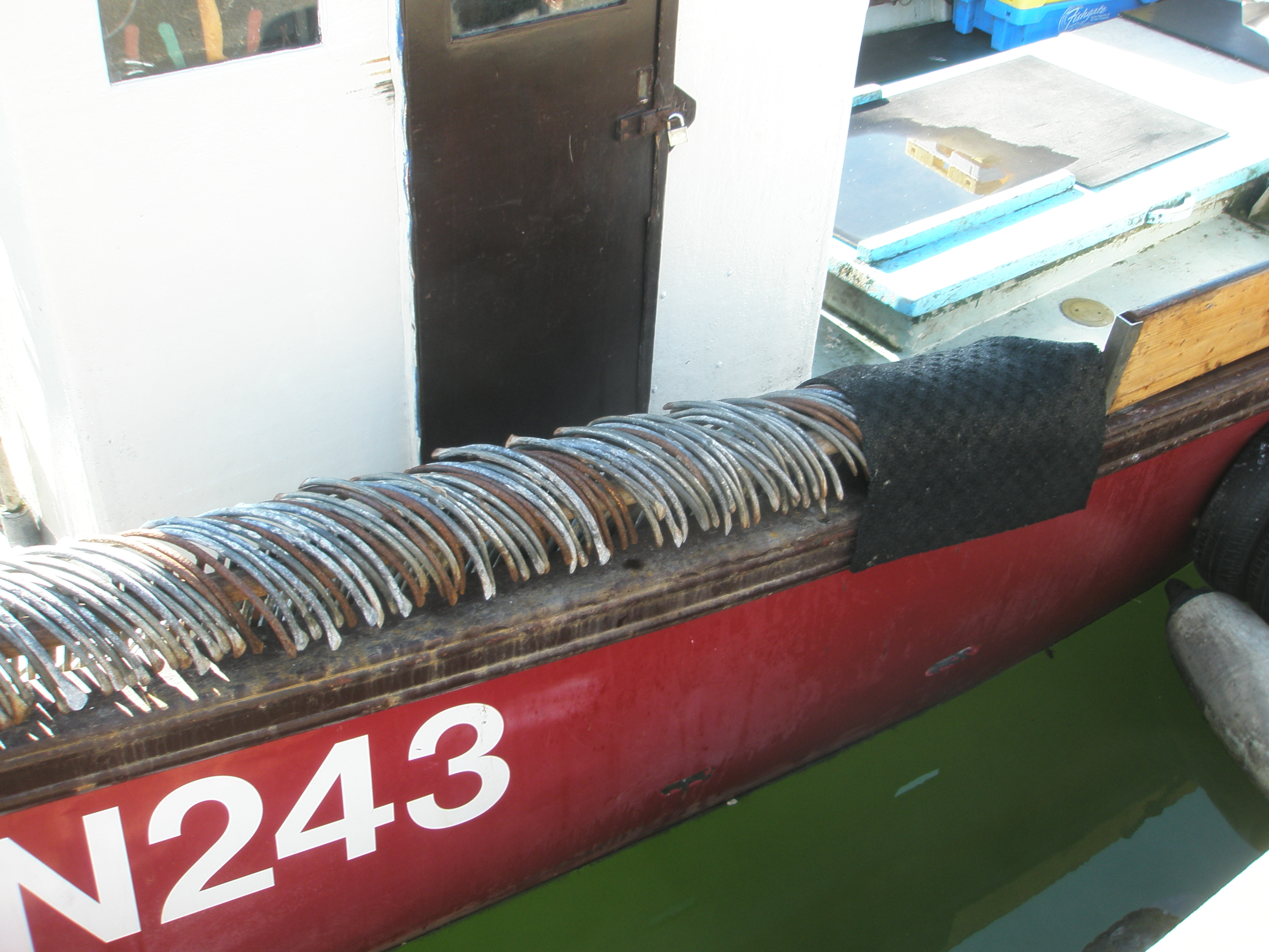 Anchors stowed neatly along the rail of the vessel