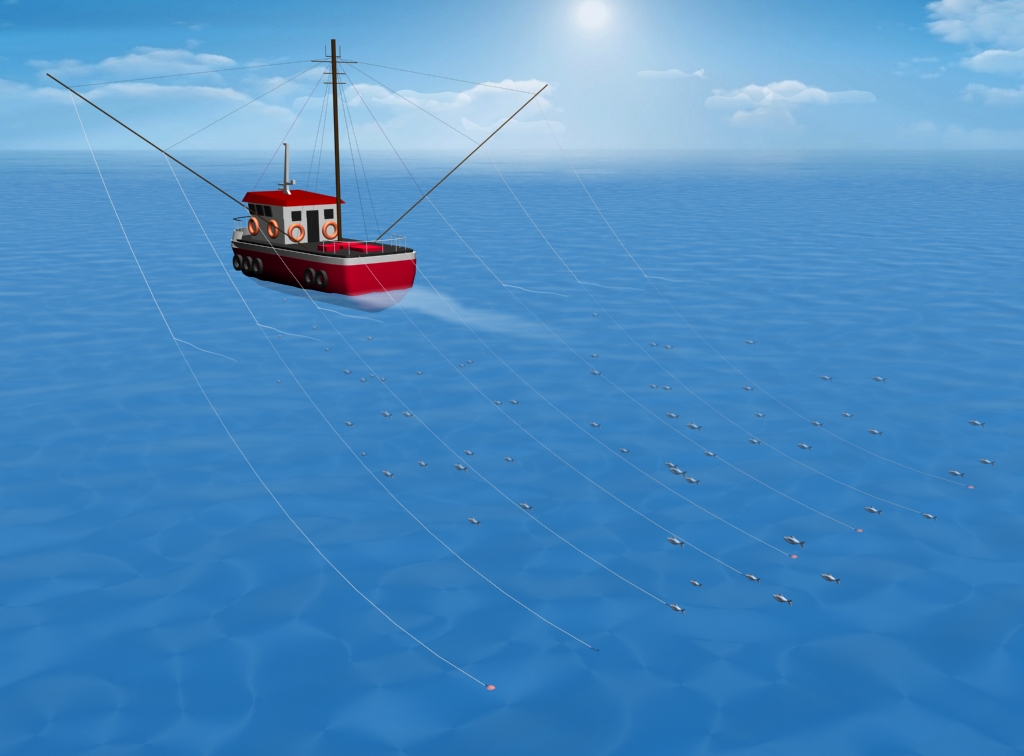 Vessel at sea with two long poles lowered down on rigging ropes