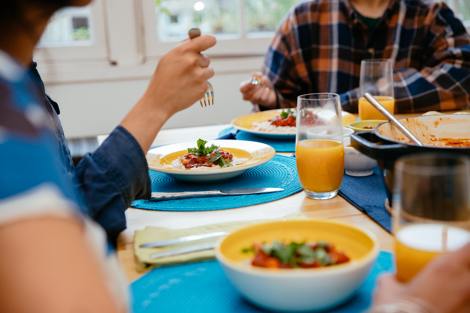 Photo of people eating seafood dish at dinner table